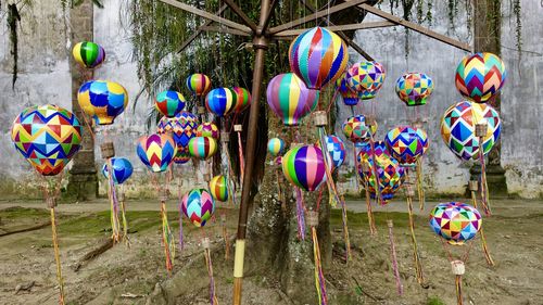 Multi colored balloons hanging outdoors