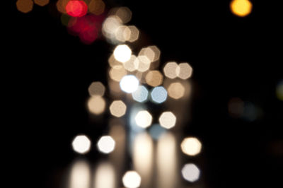 Defocused image on city against sky at night