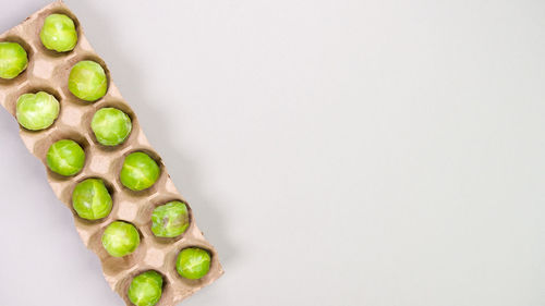 Directly above shot of christmas decorations on white background