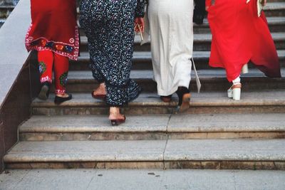 Low section of people walking on steps