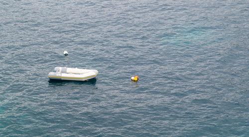 High angle view of boat floating in sea