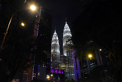 Low angle view of illuminated buildings at night