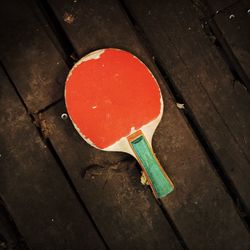 High angle view of red umbrella on wood