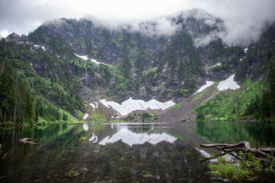 Reflection of a mountain in lake 22 found in the north cascade national forest of washington state. 