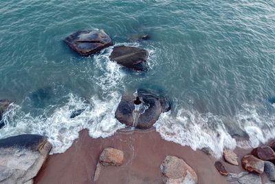 High angle view of rocks in sea