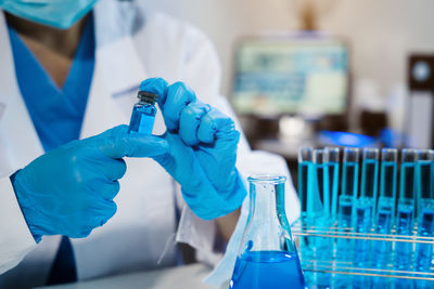 Scientist examining chemical in laboratory