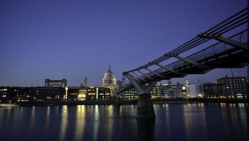 Millennium brdge over river with st. paul's cathedral in background at night