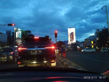 Cars on road in city