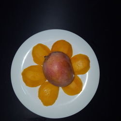 Directly above shot of orange fruits in plate