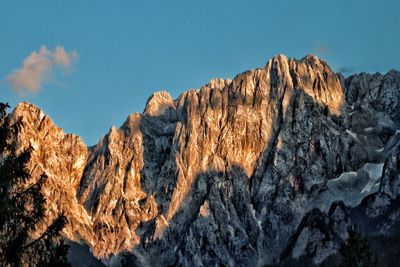 Low angle view of rock formations against sky