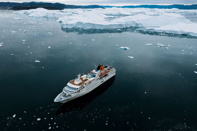 High angle view of nautical vessel on sea during winter