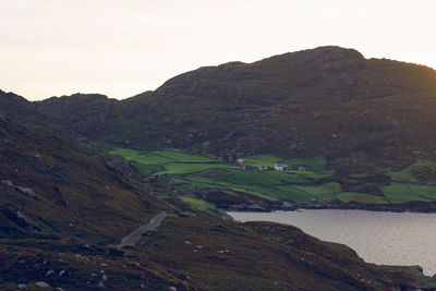 Scenic view of landscape and mountains against sky