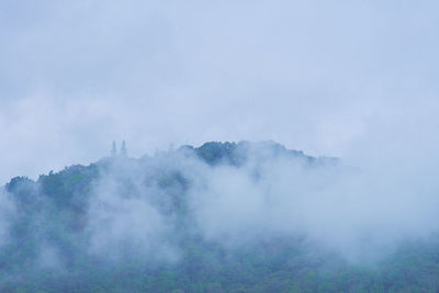 Scenic view of fog against sky