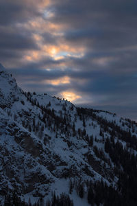 Scenic view of snowcapped mountains against sky during sunset