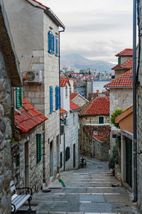 High angle view of street amidst houses in town