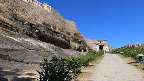 Low angle view of castle against clear blue sky