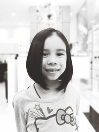 Portrait of smiling girl with short hair