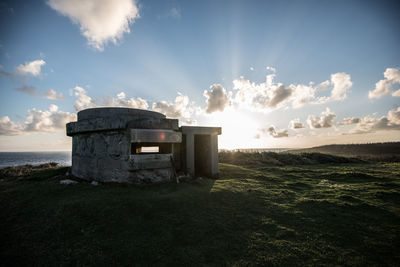 Built structure on sea against sky