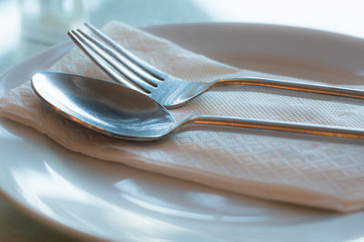 Close-up of eating utensils on table