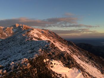 Scenic view of mountains against sky during sunset