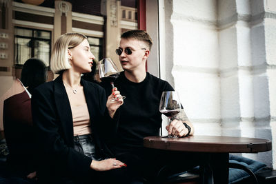 Couple sitting with drinks on table