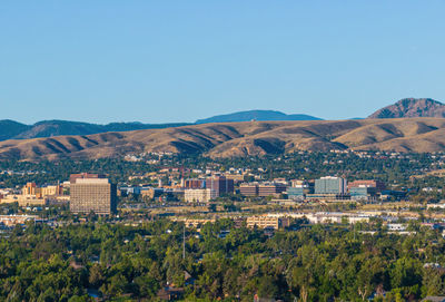 Cityscape against clear sky