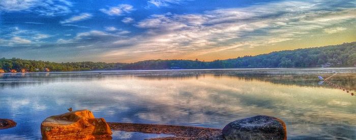 Scenic view of lake at sunset