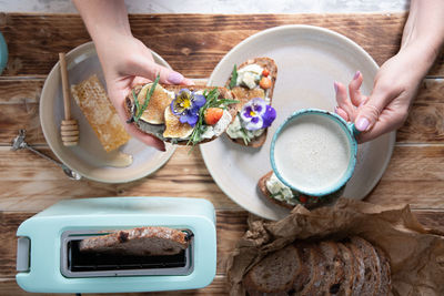 Delicious bruschetta with homemade bread, garnished with fig,soft cheese,pansies