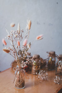 Close-up of wilted flower in vase on table