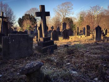 Close-up of cemetery against sky