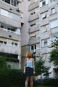 Full length of woman standing in city