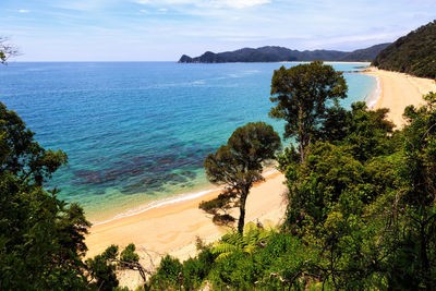 Scenic view of calm sea against blue sky