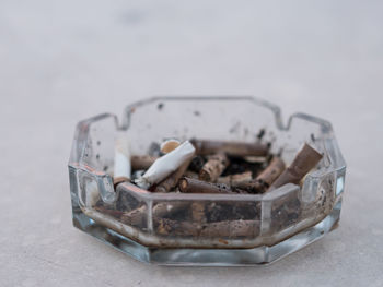 Close-up of cigarette in container