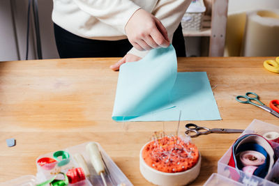 High angle view of woman preparing food on cutting board