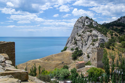 Scenic view of sea and rocks against sky