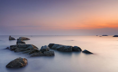 Scenic view of sea against cloudy sky