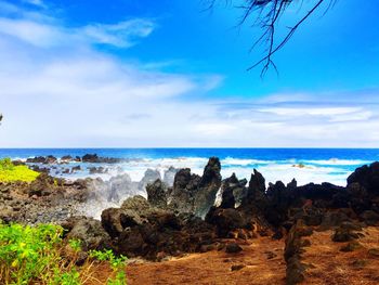 Scenic view of sea against cloudy sky