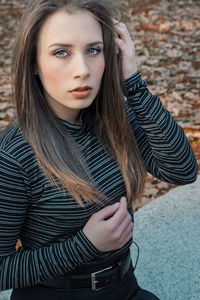Portrait of beautiful young woman with brown hair