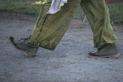 Low section of man standing on floor