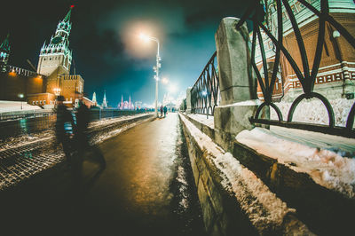 View of illuminated bridge during winter at night