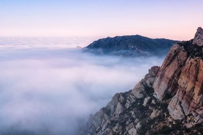 Scenic view of santa monica mountains against sky during foggy weather