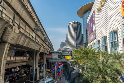 Street amidst buildings against sky