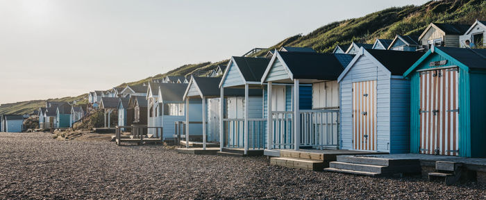 Beach huts against sky