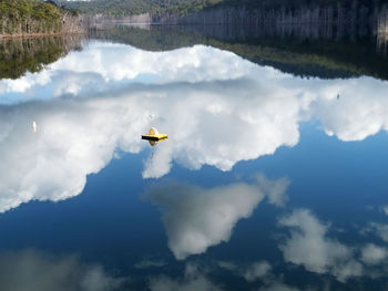 High angle view of clouds over calm lake