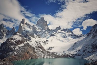 Scenic view of snowcapped mountains against sky