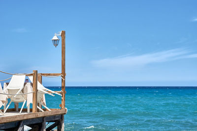 Scenic view of sea against blue sky