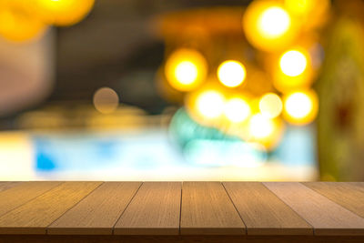 Close-up of illuminated lights on table