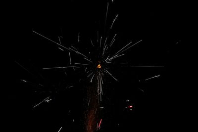 Low angle view of illuminated ferris wheel