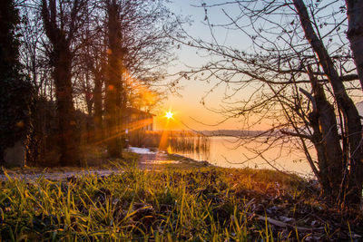 Scenic view of lake against sky during sunset