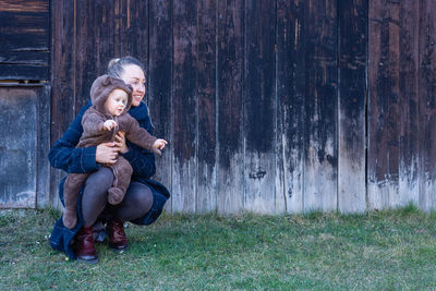 Woman holding baby in her hands. mother and son .